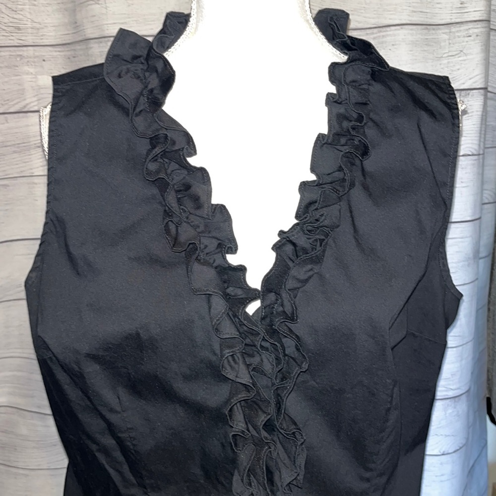 Black sleeveless ruffled top